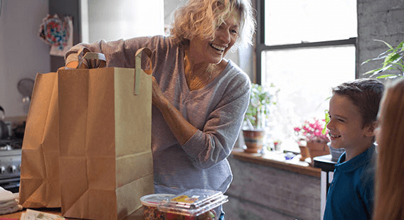 Whirlpool Mom with Two Kids Unloading Groceries